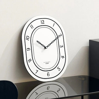 Silent Oval Wall Clock with Roman Numerals Design