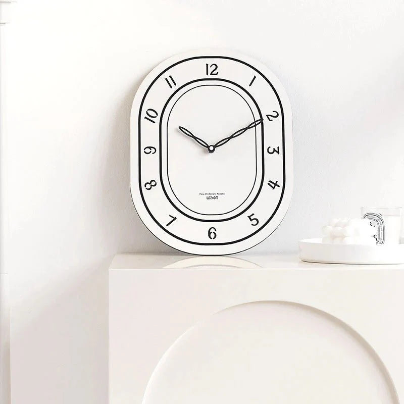 Silent Oval Wall Clock with Roman Numerals Design